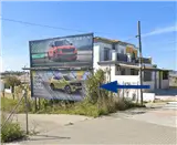 Valla publicitaria en la salida hacia Jerez y la Glorieta José Luis Borges en Sanlúcar de Barrameda